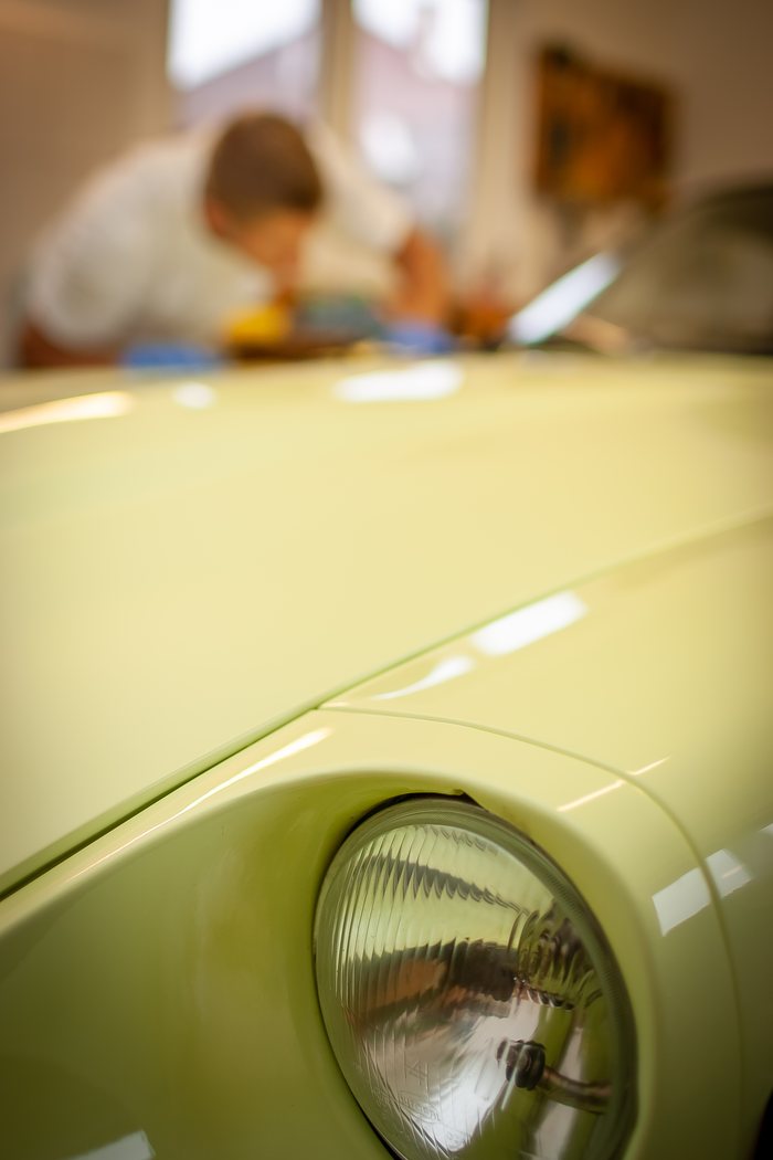 Engine bay of a Datsun 240Z being cleaned during improvement work