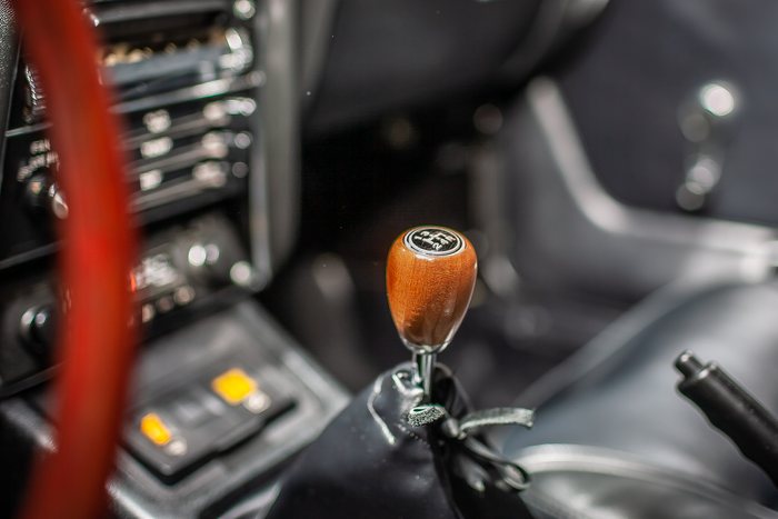Front lamp and chrome bumper detail on a Datsun 240Z