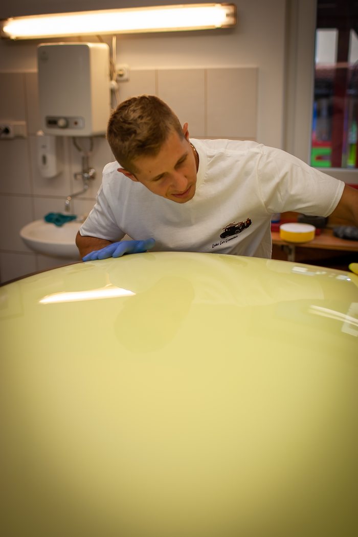 Glass and rubber seals being cleaned on a Datsun 240Z