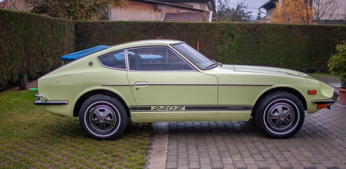 Low angle view of a Lime Yellow Datsun 240Z outdoors