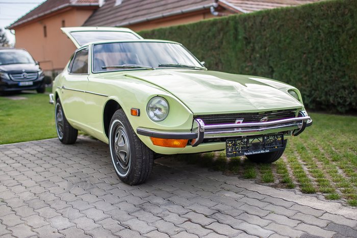 Rear quarter panel and arch of a Lime Yellow Datsun 240Z
