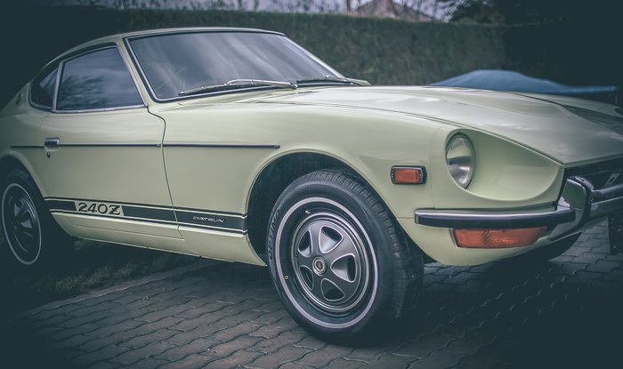 Lime Yellow Datsun 240Z three-quarter view in daylight