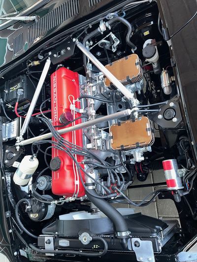 Rebuilt L28 engine bay of a Datsun 280Z seen from above