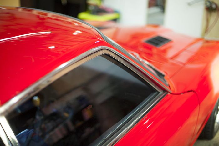 Roofline and rear glass of a red Datsun 280Z