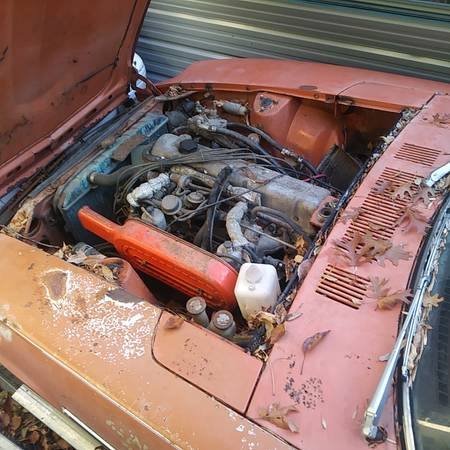 Original Datsun 240Z L24 engine bay before rebuild with SU carburettors — barn find condition