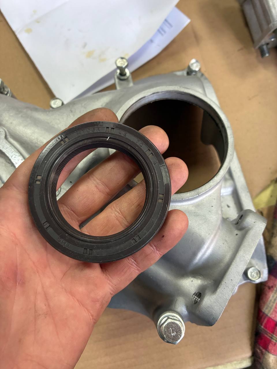 New front crank seal refinished Datsun L24 cover — 240Z engine rebuild