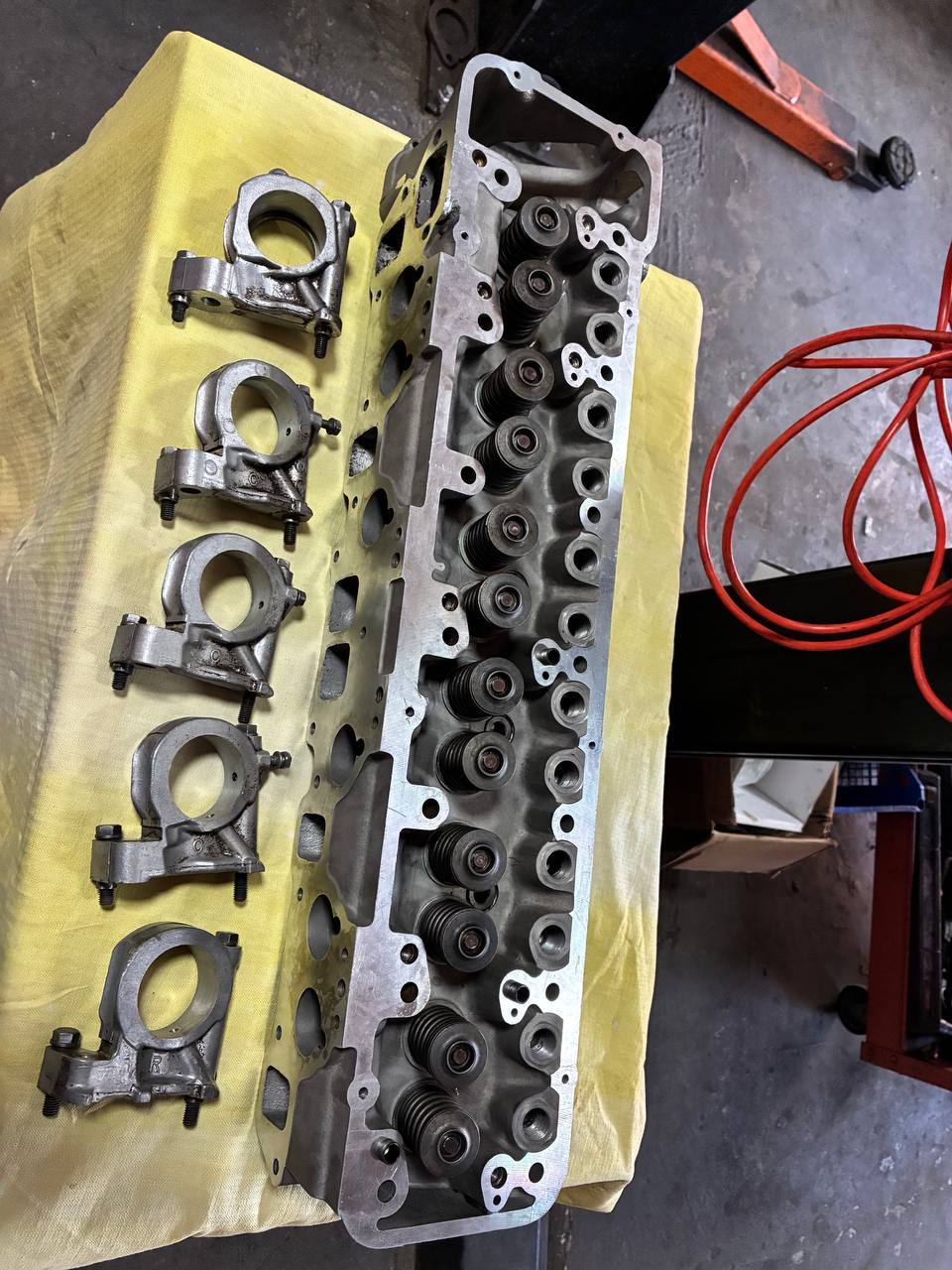 Datsun N42 combustion chambers marked valve seat checking — 240Z engine rebuild