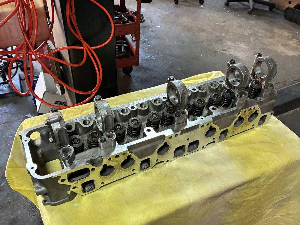 Datsun N42 cylinder head reassembled valves springs — 240Z engine rebuild