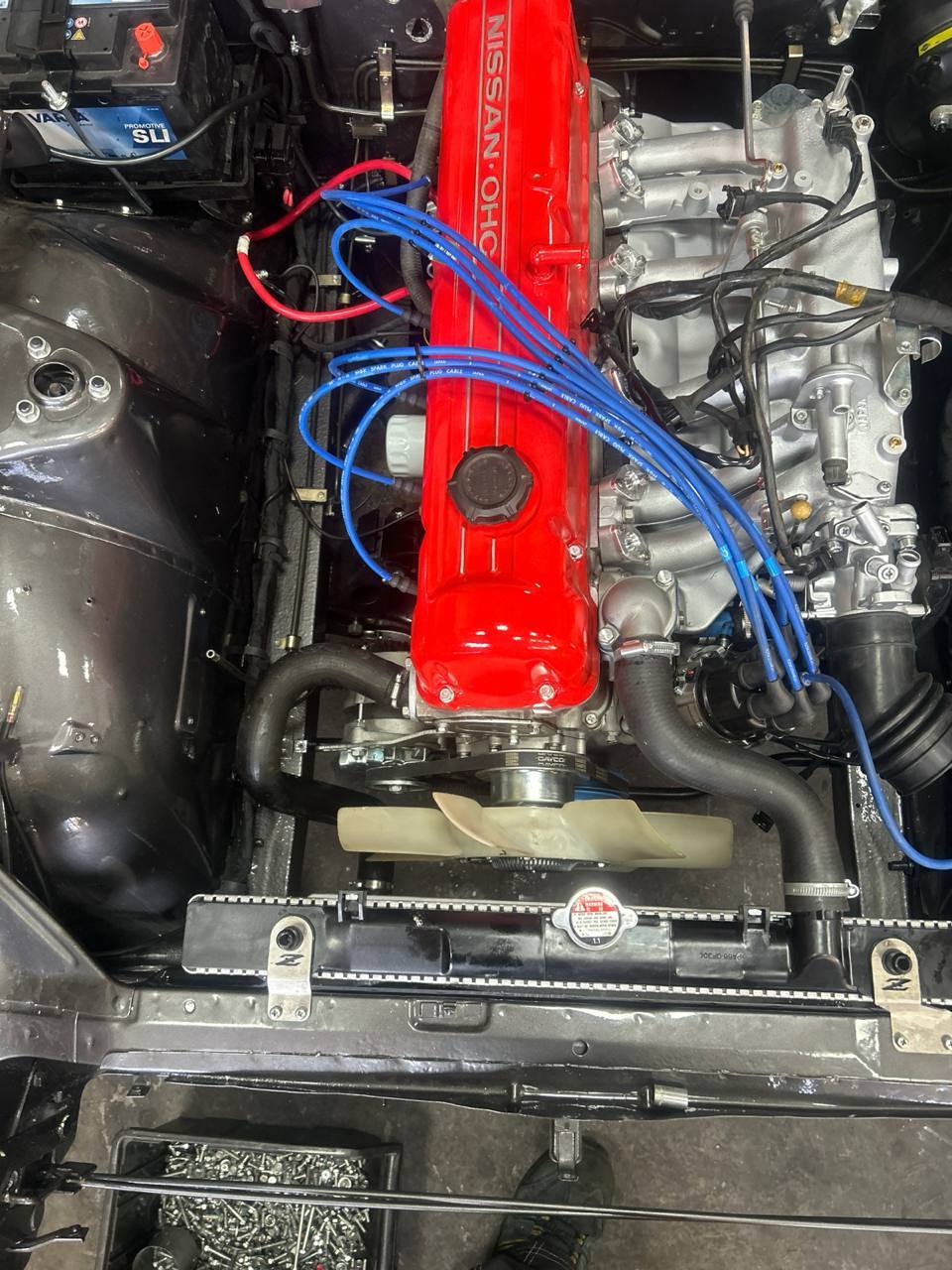 Finished Datsun 240Z L24 engine installed red OHC cam cover N42 intake Bosch injection gunmetal bay
