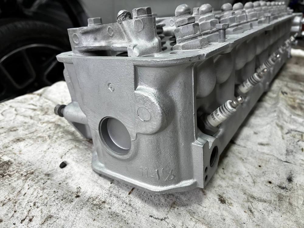 Datsun N42 cylinder head after media blasting cleaned to bare metal — L24 rebuild