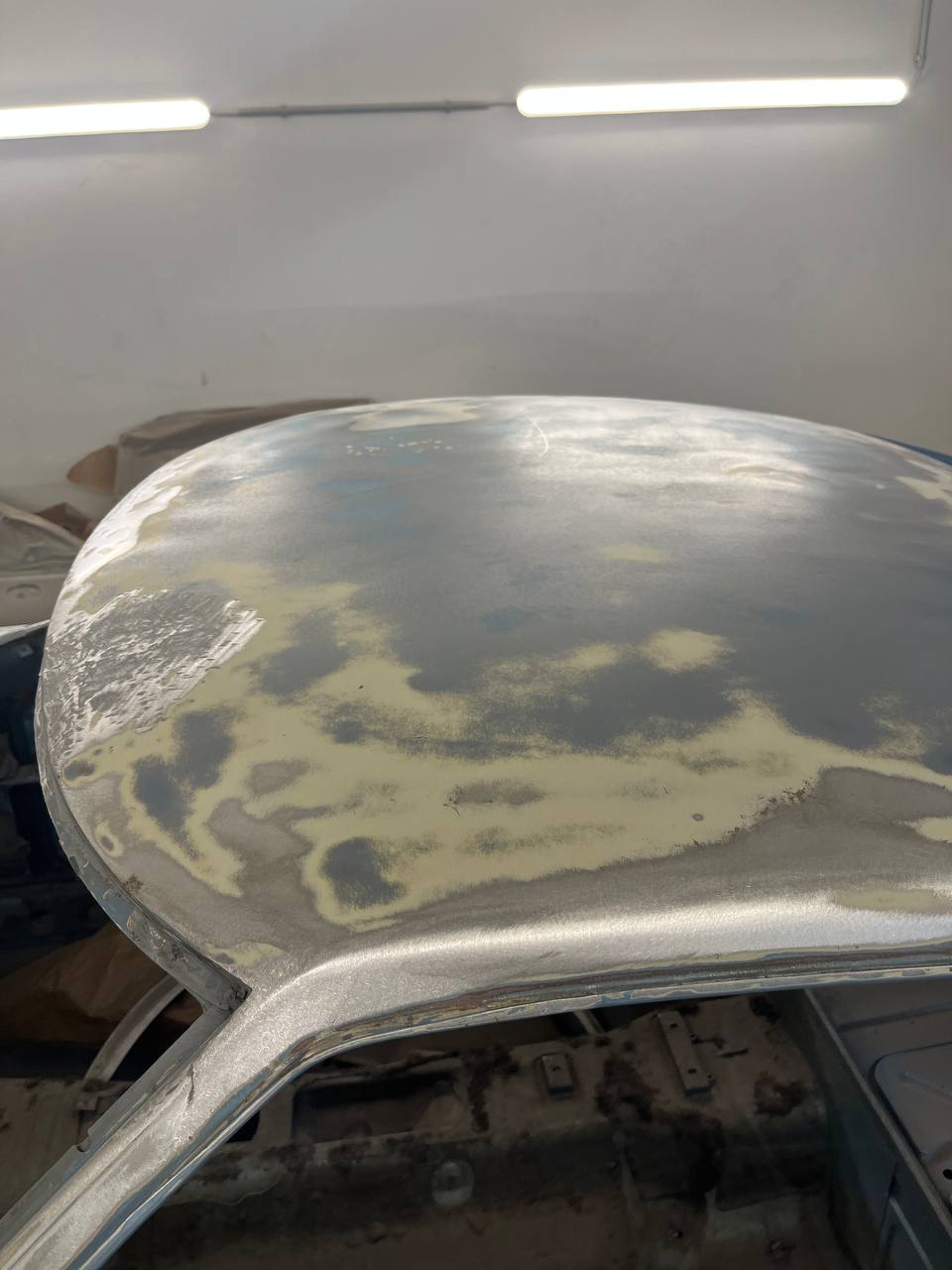Datsun 260Z paint removal and bodywork preparation — bare metal restoration
