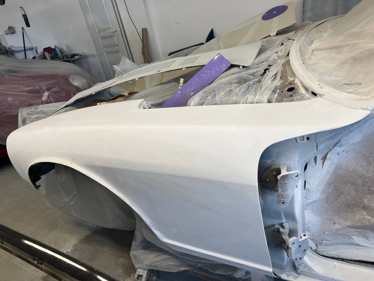 Datsun 260Z primer bodywork detail — panel preparation S30 restoration