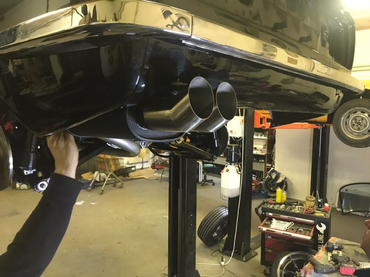 Abarth sports exhaust fitted to a restored Datsun 280Z — twin tailpipes under the rear valance