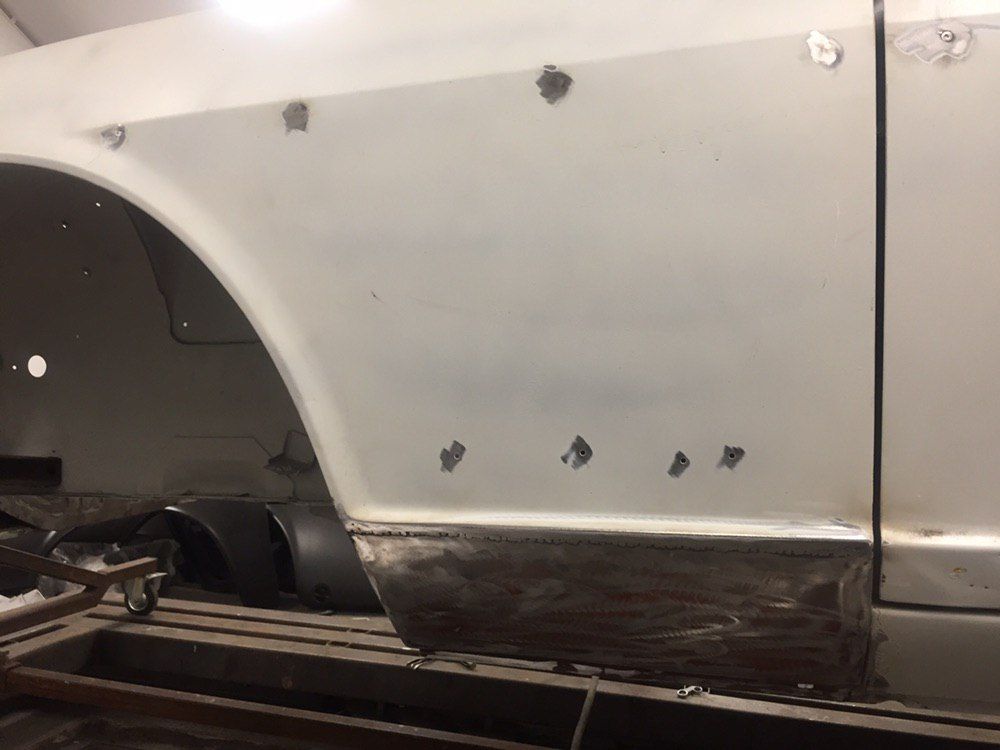 New lower section welded into an original Datsun 280Z quarter panel — rust repair