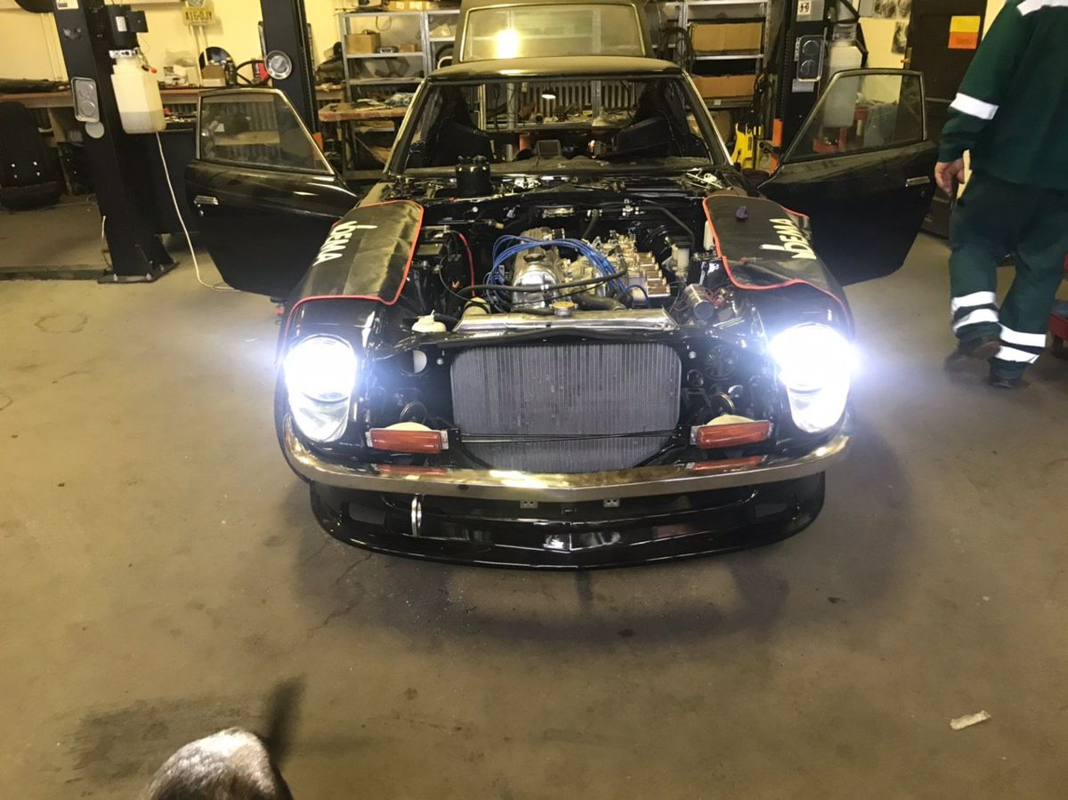 Datsun 280Z during final systems testing — headlights and electrics checked before delivery
