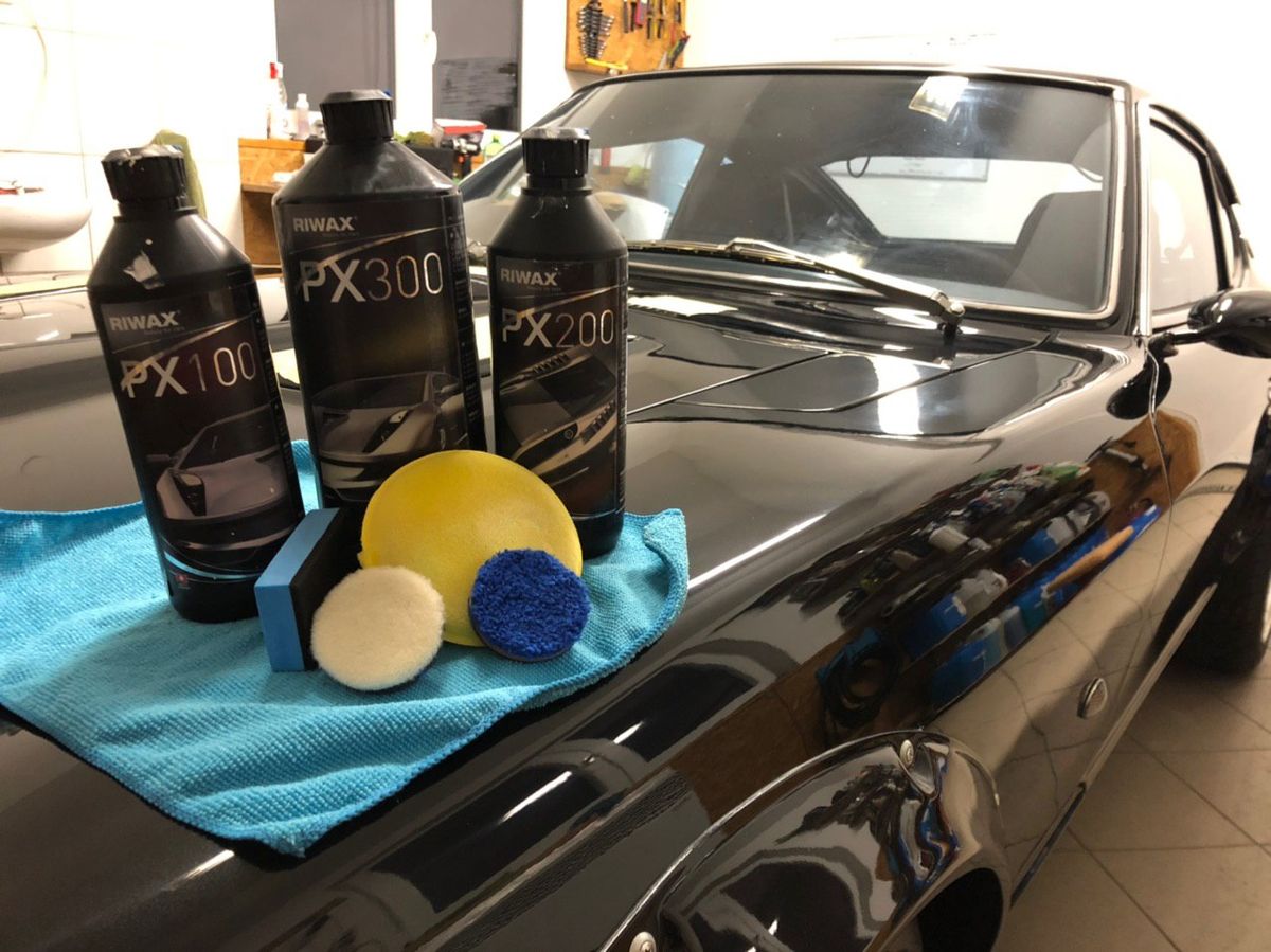 Three-stage paint correction compounds and pads on a restored Datsun 280Z