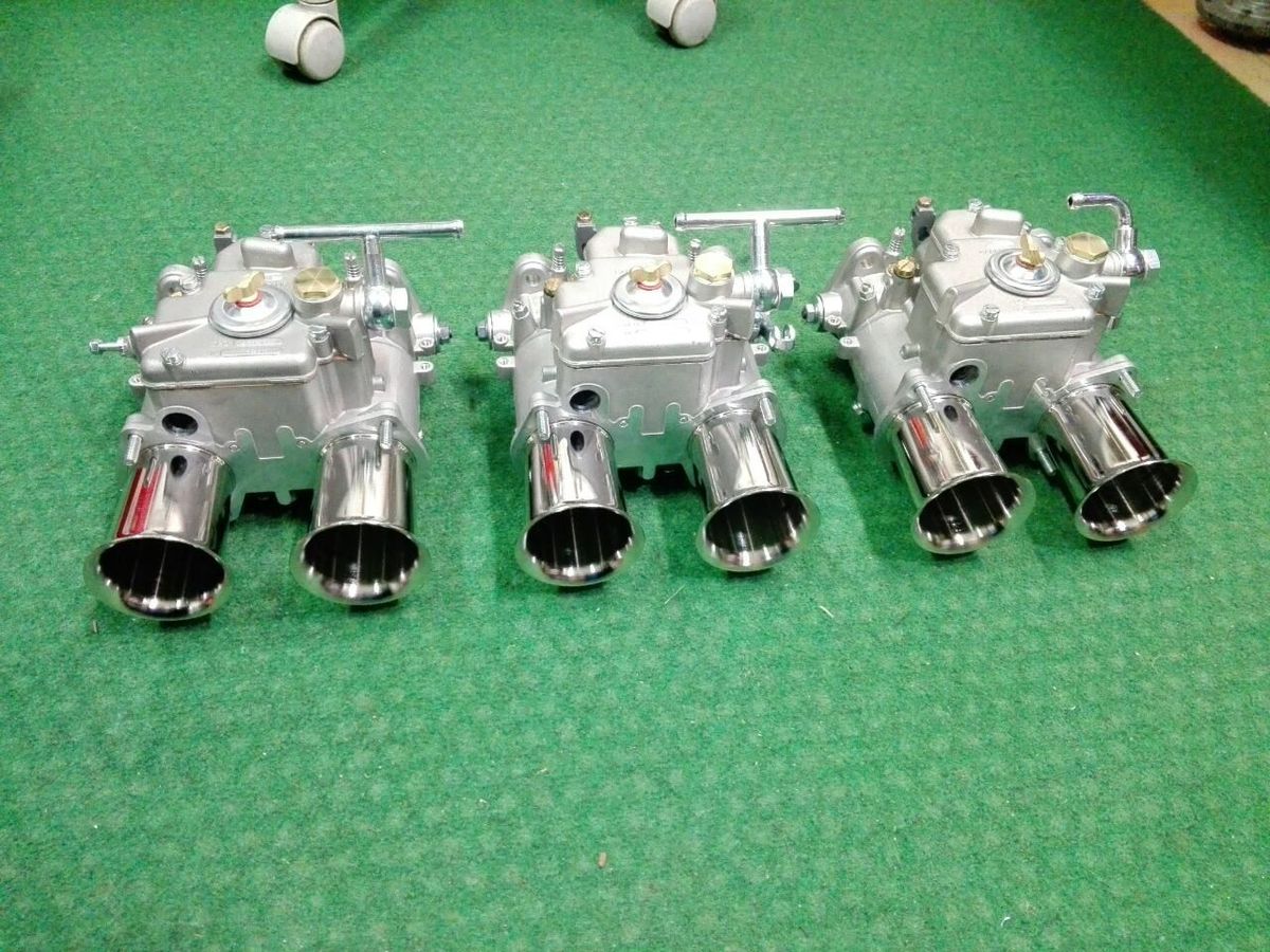 Triple Weber DCOE carburettors with velocity stacks for a Datsun 280Z engine build