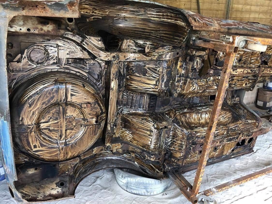 Datsun 280Z inner structure media blasted to bare metal, exposing the true extent of rust and corrosion