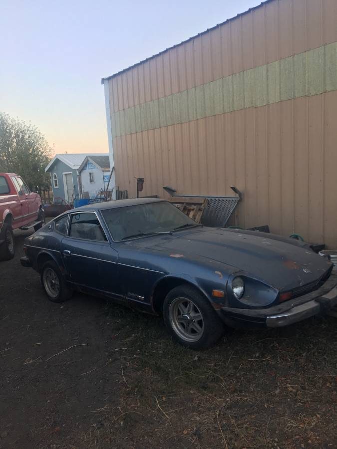Front of the 1976 Datsun 280Z as found in Idaho, chalky original paint, before the USA to Europe import