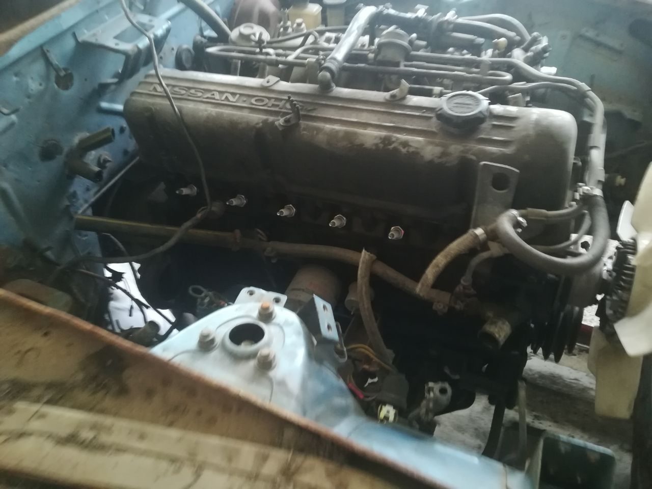 Datsun 280Z L28 inline-six with the original NISSAN OHC cam cover, before restoration