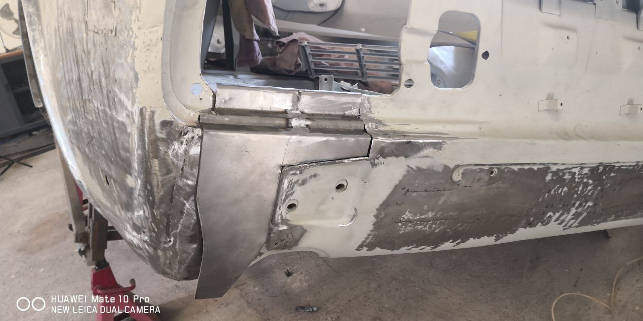 Datsun 280Z rear quarter panel cut out and repaired with new metal let into the original panel