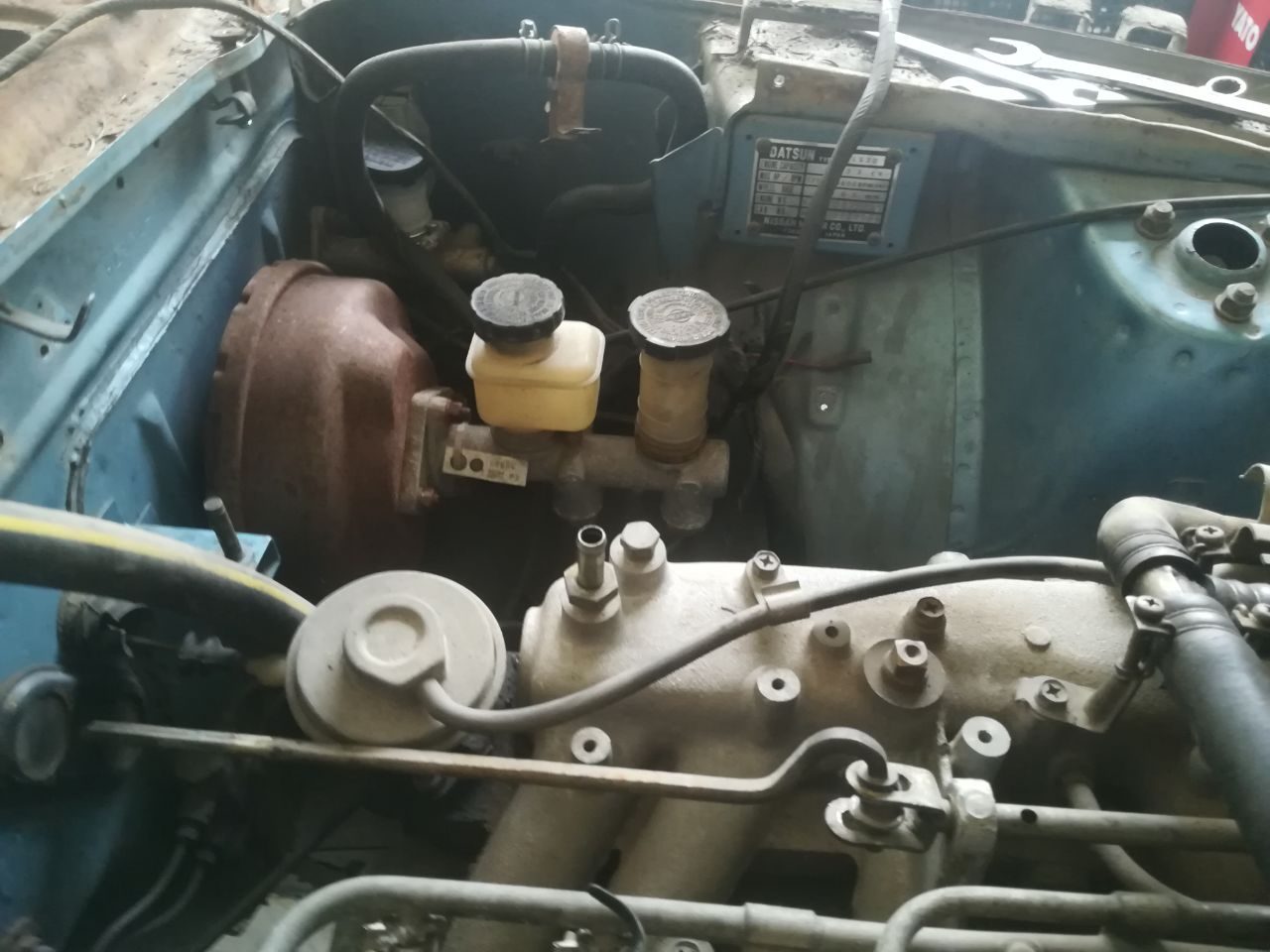 Rust eaten completely through a structural section of the Datsun 280Z, leaving holes in the metal — S30 corrosion