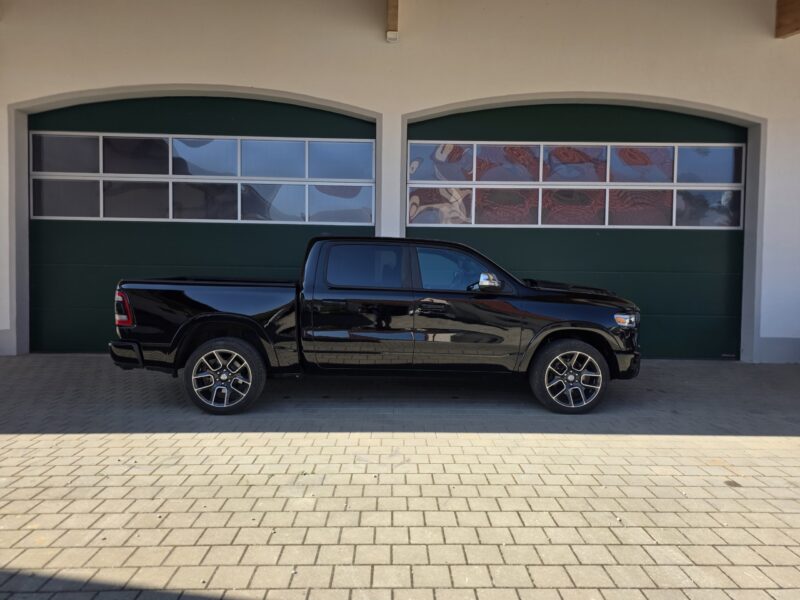 dodge Ram 1500 Gen 5 2022 Limited Black pickup truck right side profile image
