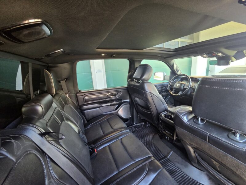 dodge Ram 1500 Gen 5 2022 Limited Black pickup truck interior with glass roof and leather seats image