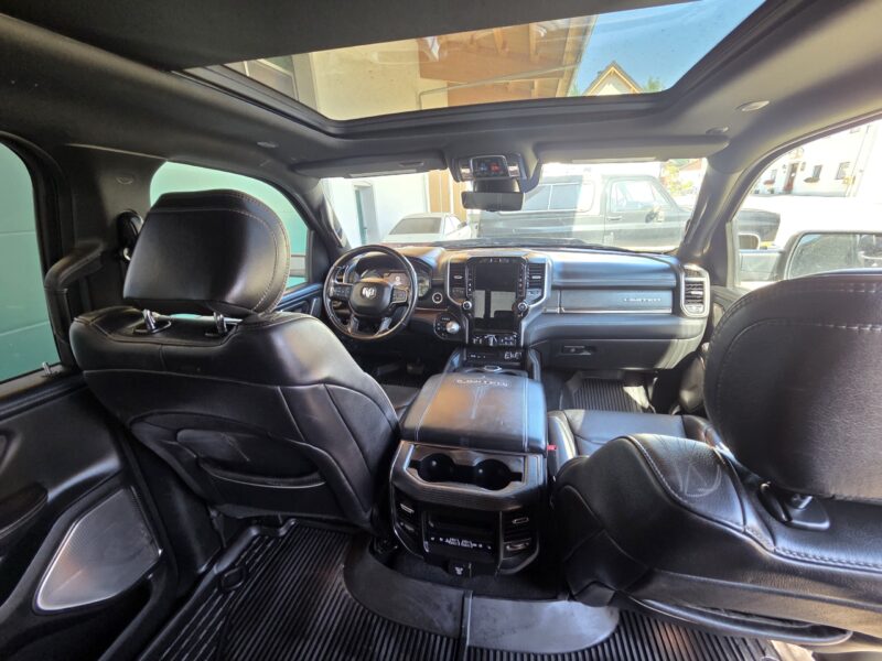 dodge Ram 1500 Gen 5 2022 Limited Black pickup truck interior with glass roof image