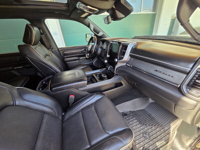 dodge Ram 1500 Gen 5 2022 Limited Black pickup truck interior and centre console and passenger leather seat