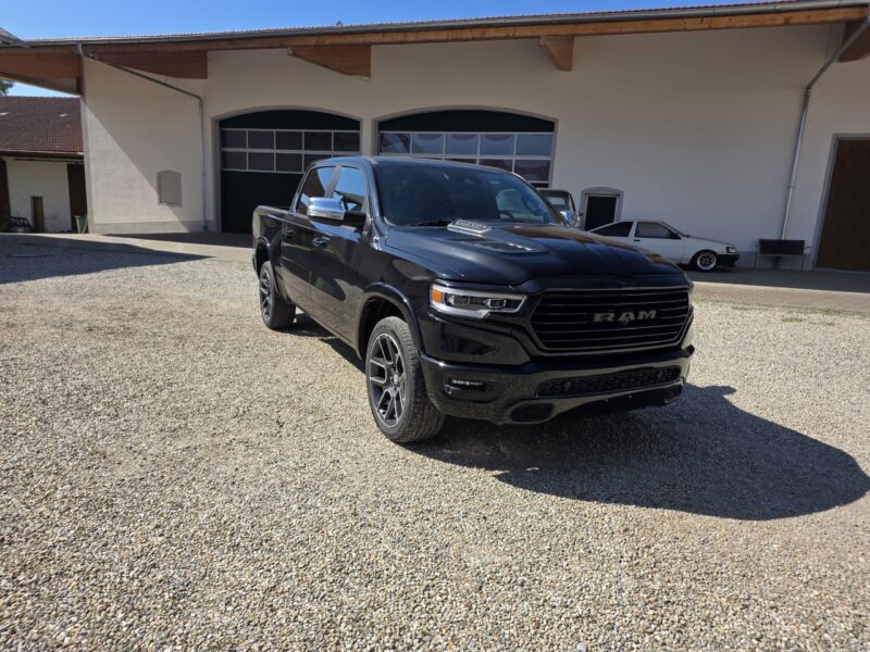 dodge Ram 1500 Gen 5 2022 Limited Black pickup truck main side profile image with 22 inch wheels chrome and grey for sale