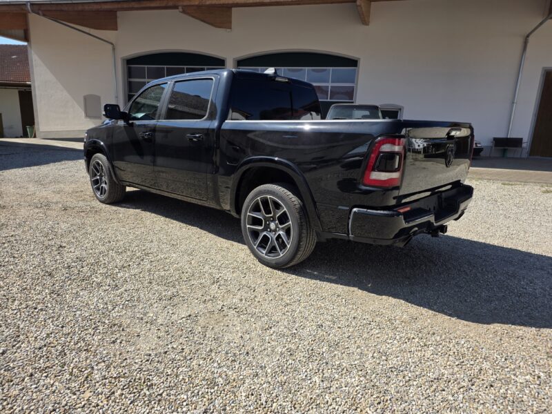 dodge Ram 1500 Gen 5 2022 Limited Black pickup truck side profile image