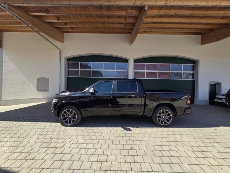dodge Ram 1500 Gen 5 2022 Limited Black pickup truck main side profile image